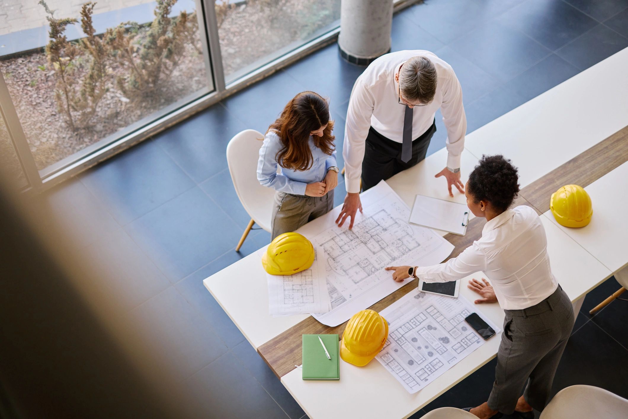 Architects reviewing plans during a project meeting